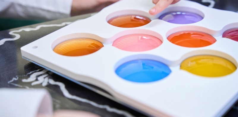A person viewing a range of different colored lens tints.