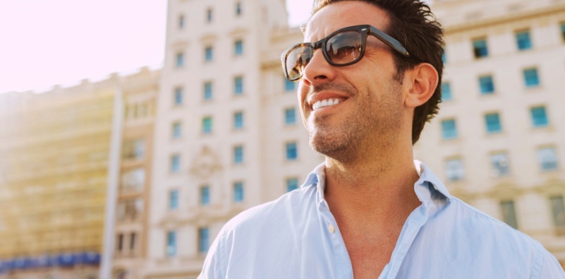 A man outside wearing sunglasses.
